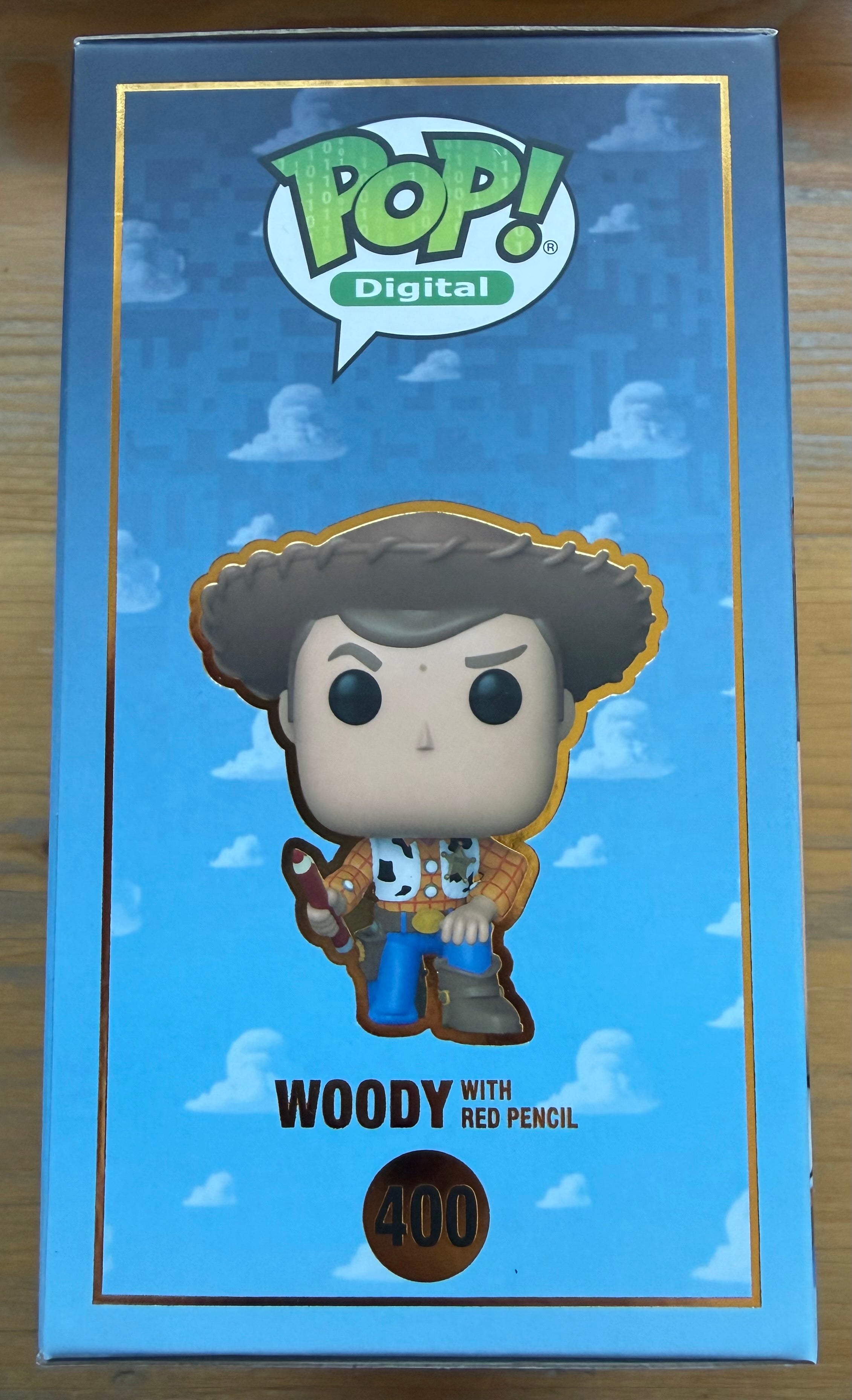 Woody Funko Pop box with Woody illustration, number 400, and red pencil accessory
