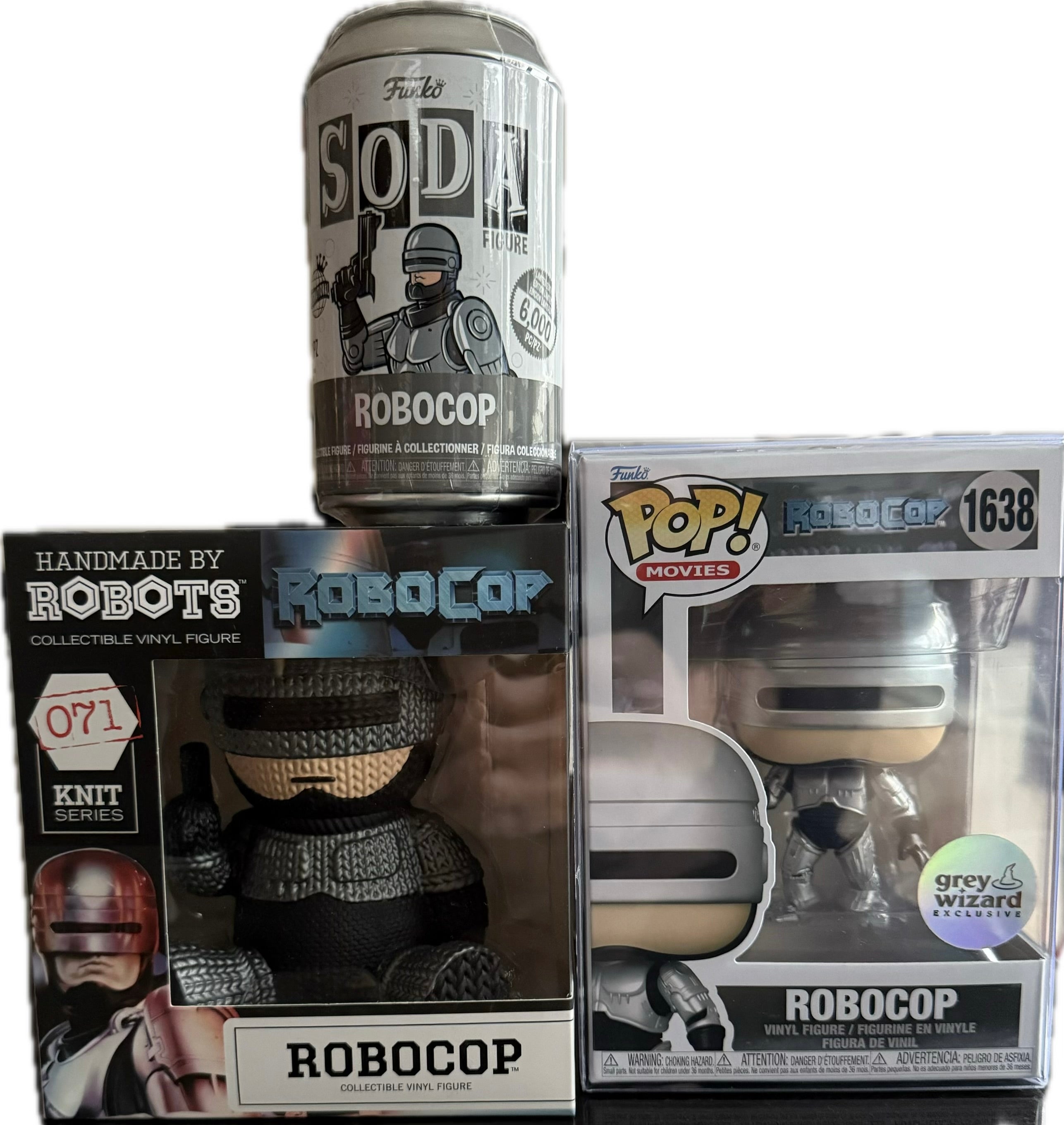 Collectible vinyl figure in box labeled ROBOCOP, with dark armored character figure
