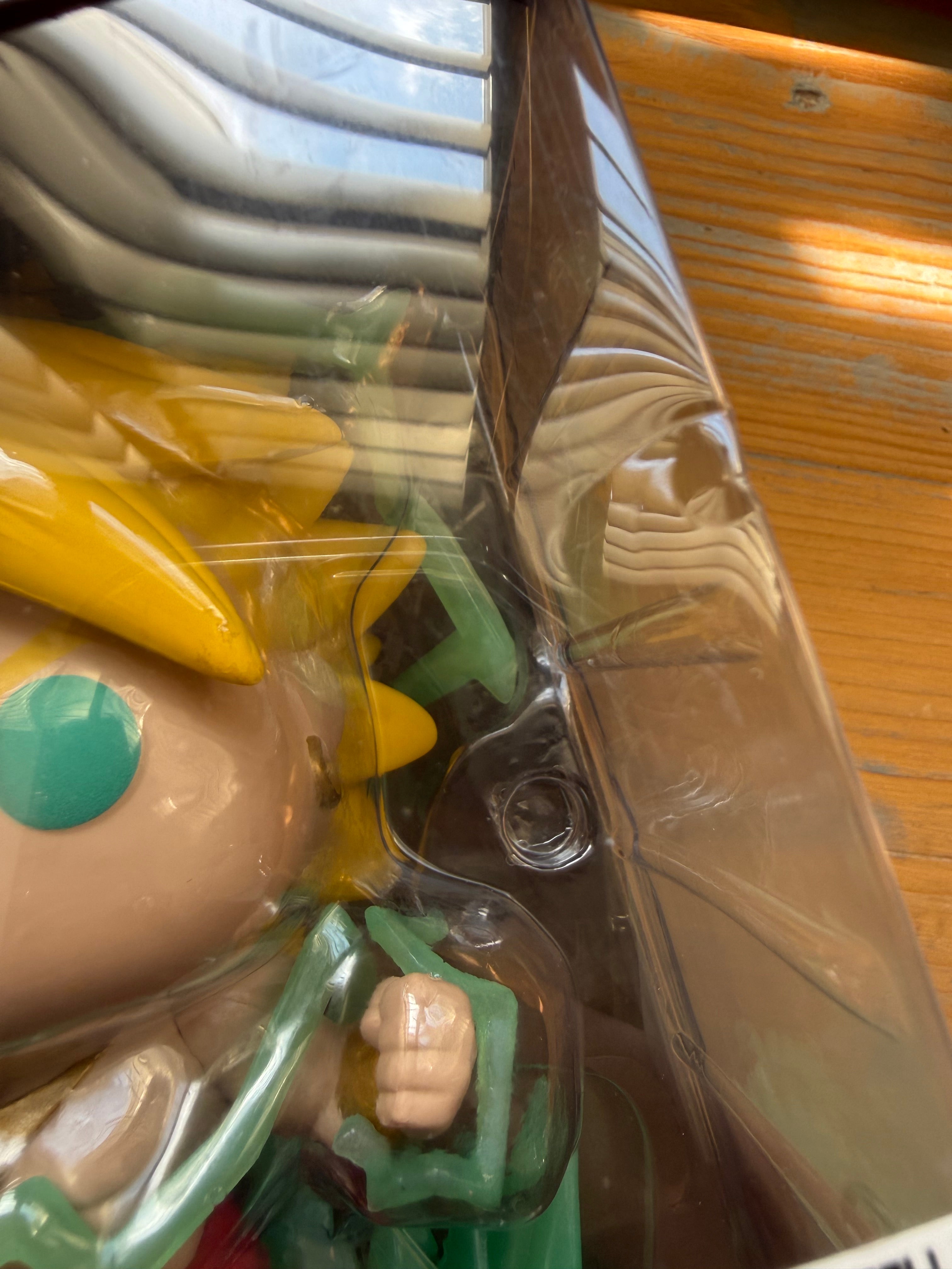 Funko Pop! vinyl figure in clear box, close-up of Broly’s face and green eyes