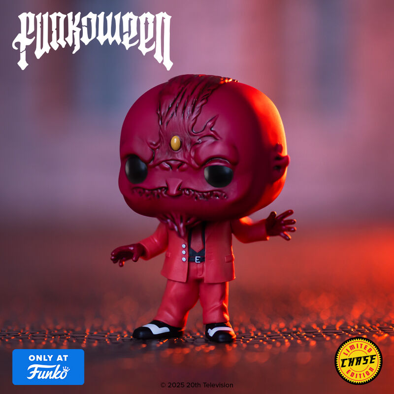 Vinyl collectible Sweet figure in red suit with outstretched arms and yellow eye