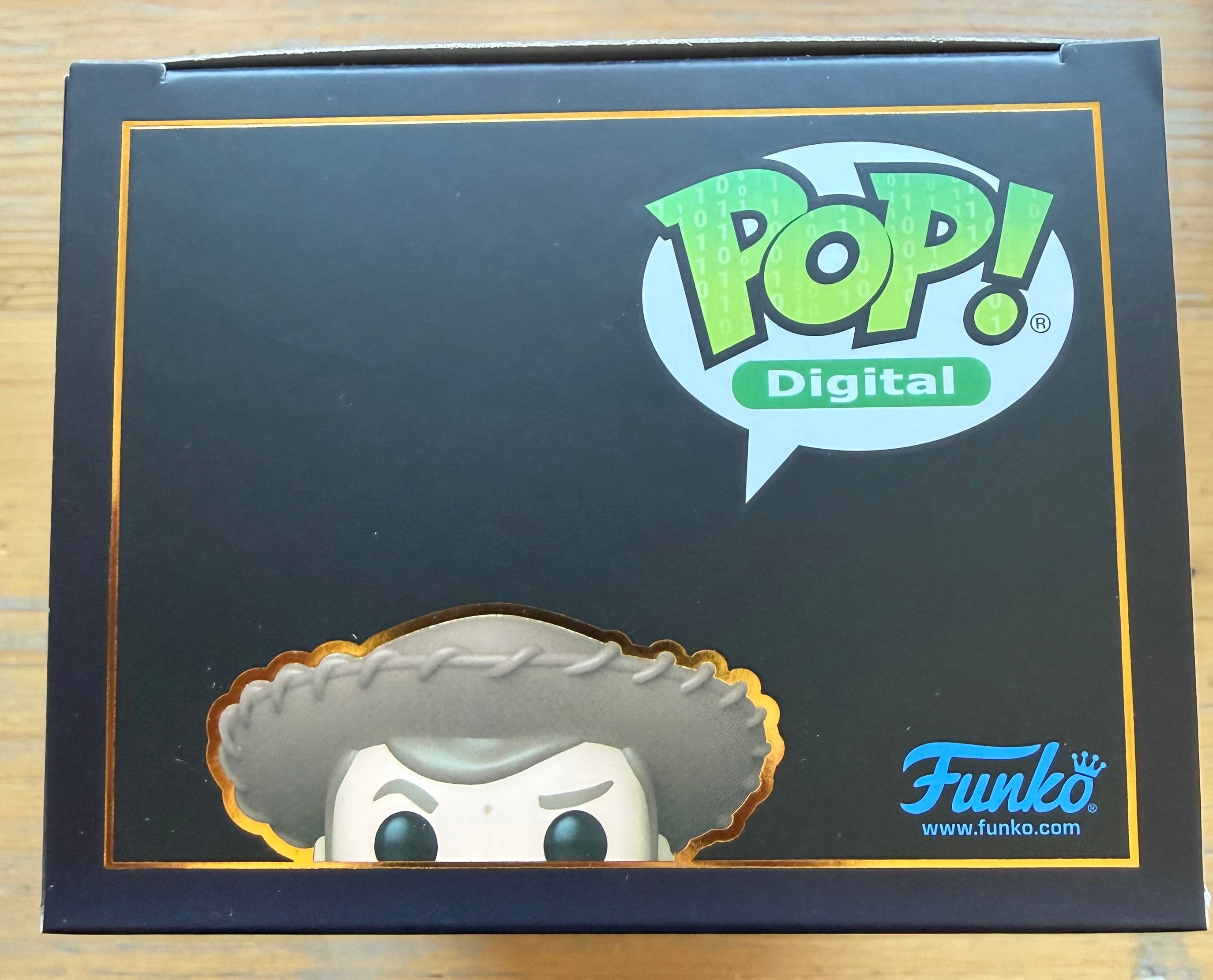 Funko Pop Digital box side with Pop logo and partial Woody head illustration