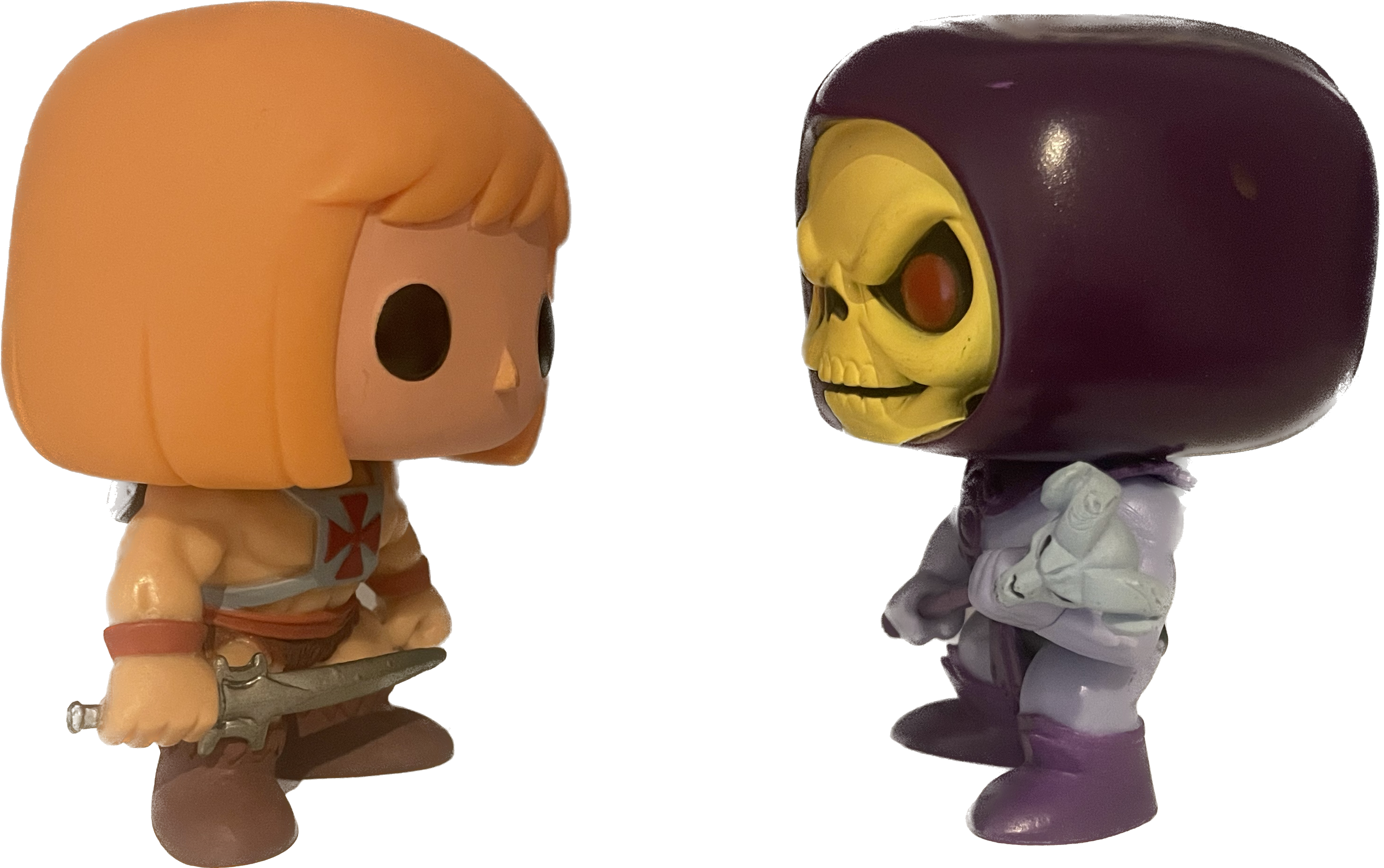 Funko Pop! He-Man and Skeletor vinyl figures, side view, out of box