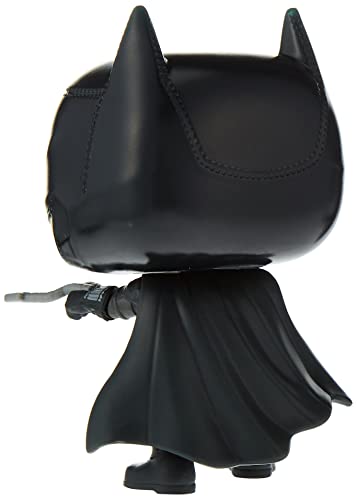 Vinyl Batman figure side view with black cape and cowl, holding a cane