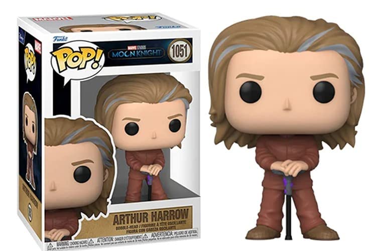 Vinyl collectible figure with tan hair, dark eyes, and brown robe, hands clasped