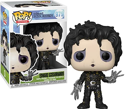 Vinyl collectible figure of a dark-haired man in black studded outfit with silver scissor hands