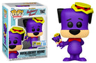 Boxed purple vinyl dog figure with yellow cap and red bow tie, plus small accessory