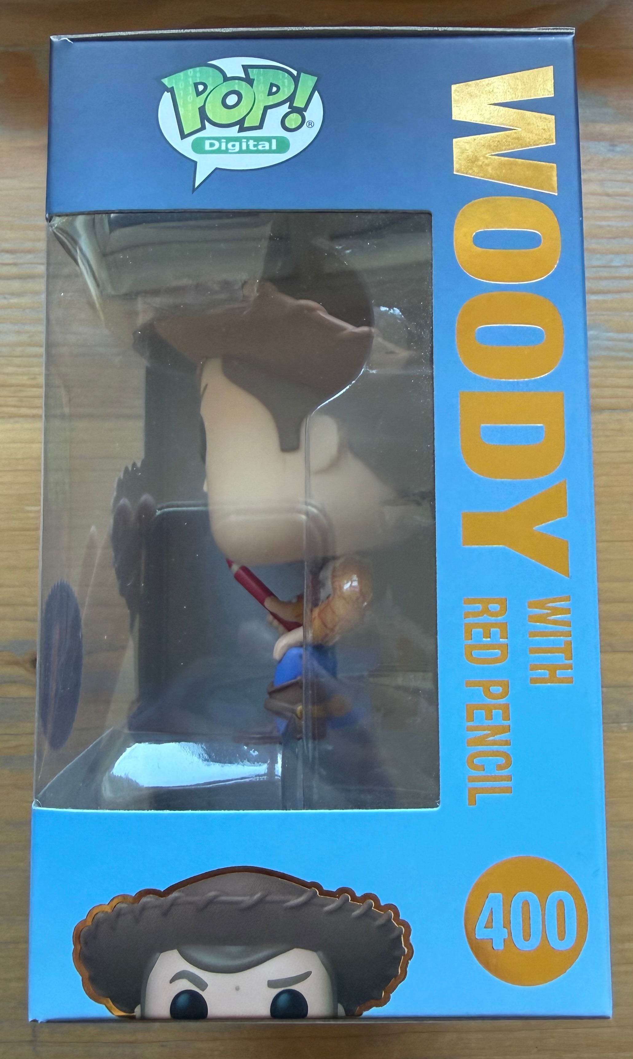 Woody Funko Pop box side panel with number 400 and Woody holding a red pencil