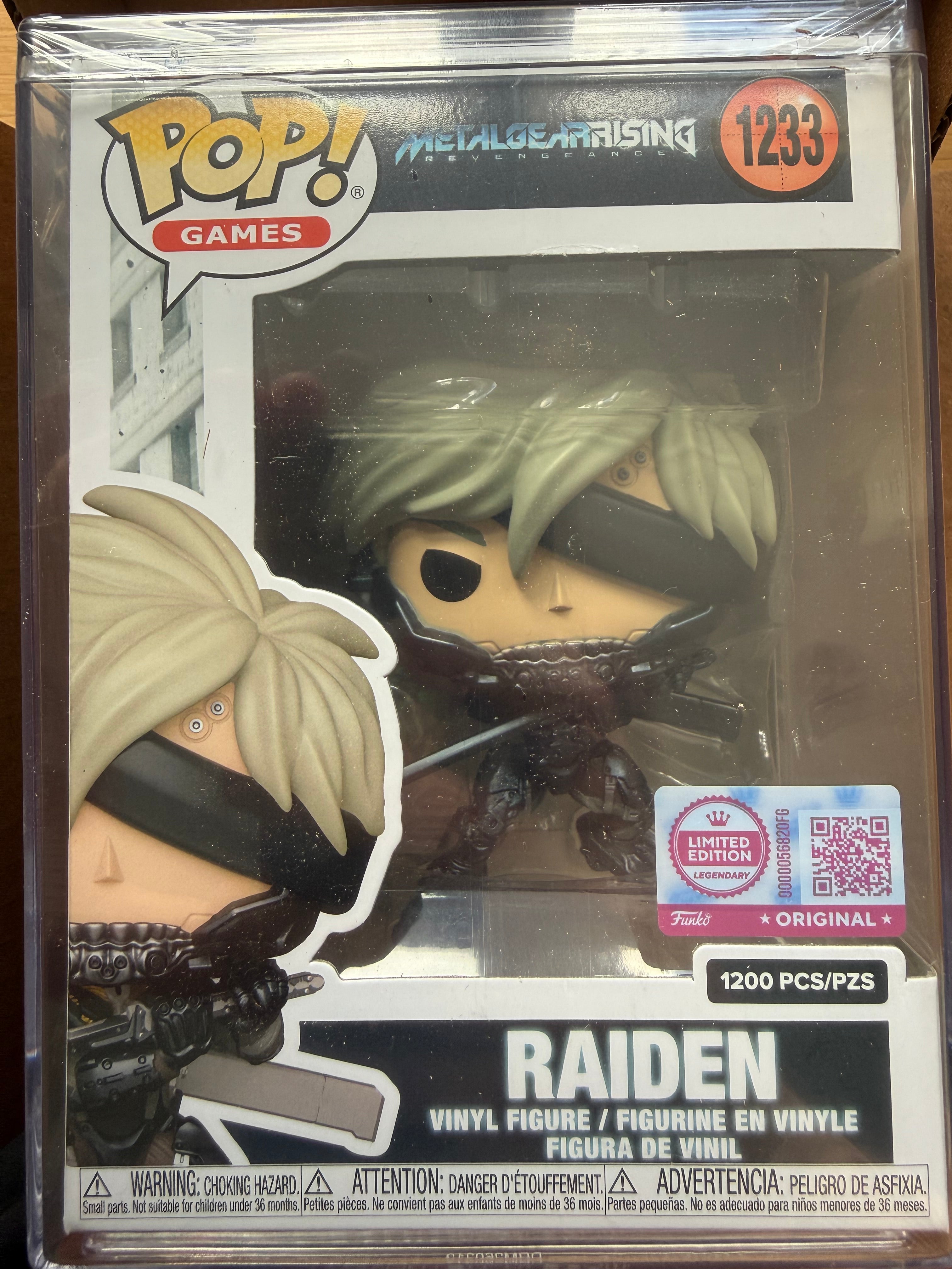 Raiden vinyl figure in box with pale green hair, black armor, and visible blades