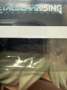 Close-up of pale green hair and eye area on Raiden vinyl figure behind plastic