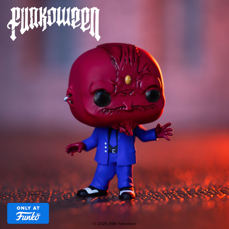 Vinyl collectible figure with red demon head and blue suit, standing with arms out