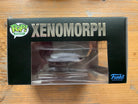 Funko Pop! Digital Xenomorph figure in retail box, window display on black packaging