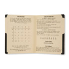 Spy code-breaking instruction booklet with code grid and practice questions