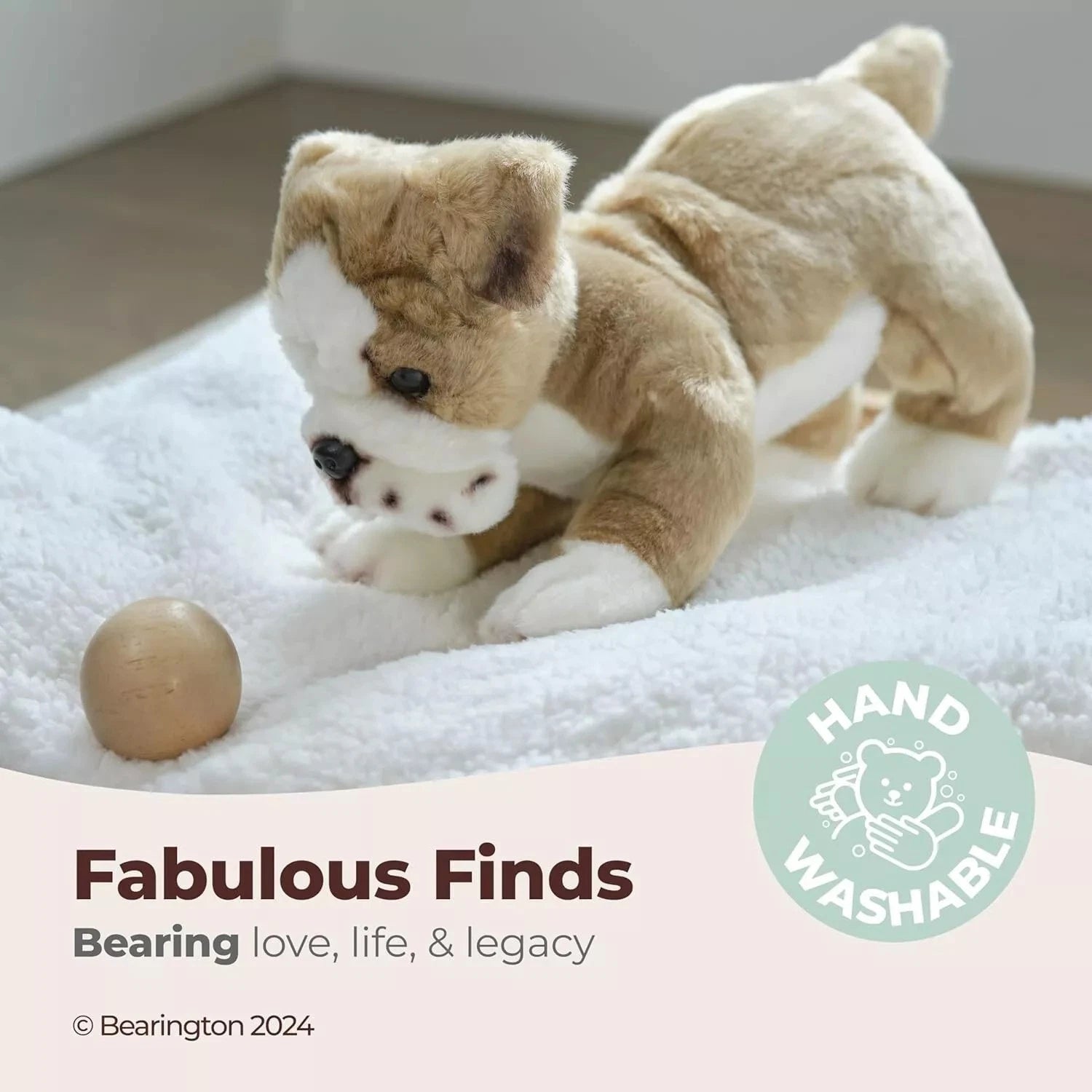 Tan and white bulldog plush lying down, head tilted toward the side