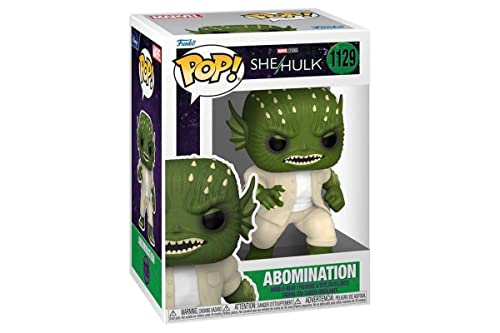 Boxed vinyl collectible figure: green spiky creature in white pants and jacket