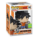 Vinyl Goku collectible figure in box, orange top, blue pants, holding steering wheel